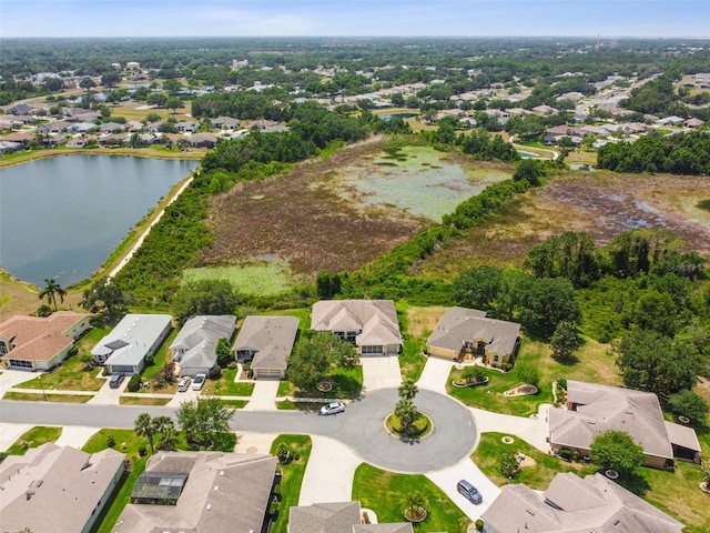 bird's eye view with a residential view and a water view