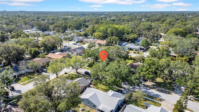 aerial view featuring a residential view and a wooded view