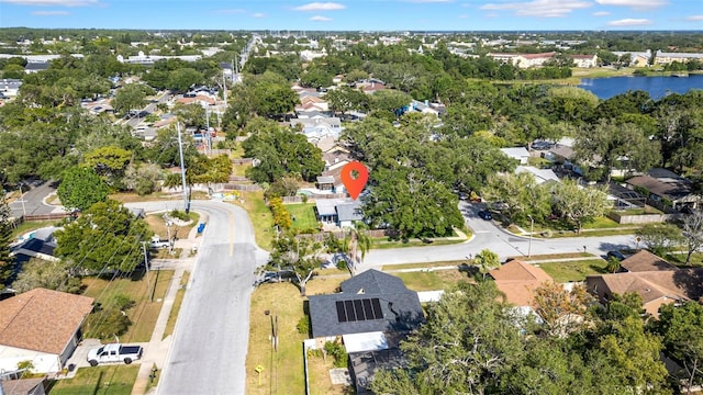 bird's eye view featuring a water view and a residential view