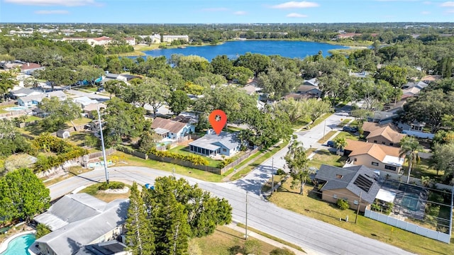 drone / aerial view with a water view and a residential view