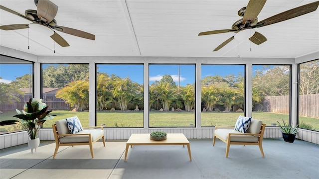 sunroom featuring a ceiling fan and an outdoor hangout area
