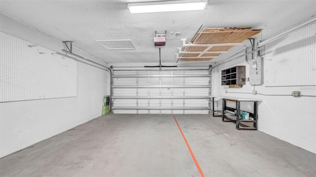garage with a garage door opener and electric panel
