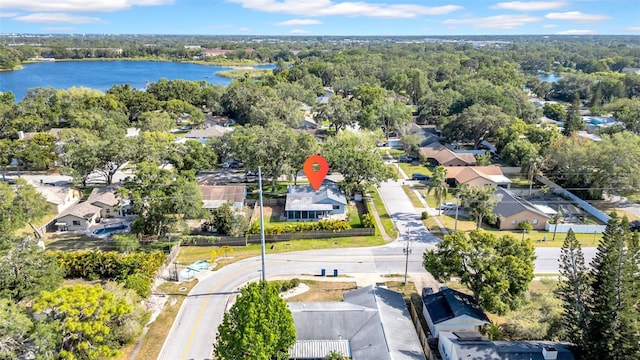 birds eye view of property featuring a water view and a residential view