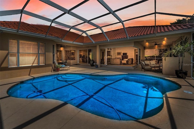1033 Tuscany Dr, Trinity, FL 34655 - pool at dusk featuring a patio, ceiling fan, and an outdoor pool