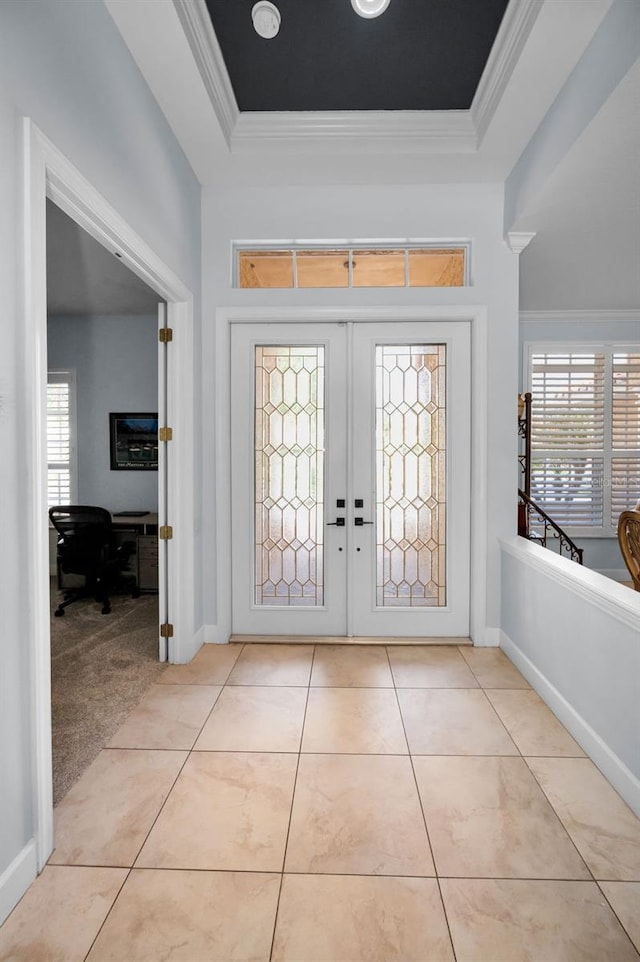 1033 Tuscany Dr, Trinity, FL 34655 - entrance foyer featuring light tile patterned floors, a raised ceiling, ornamental molding, and french doors