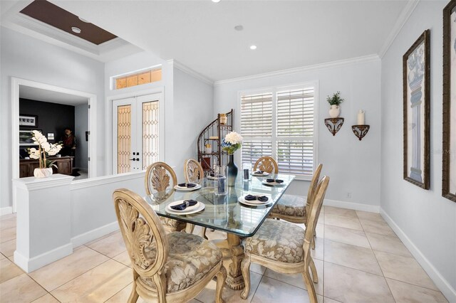 1033 Tuscany Dr, Trinity, FL 34655 - dining space with ornamental molding and light tile patterned floors