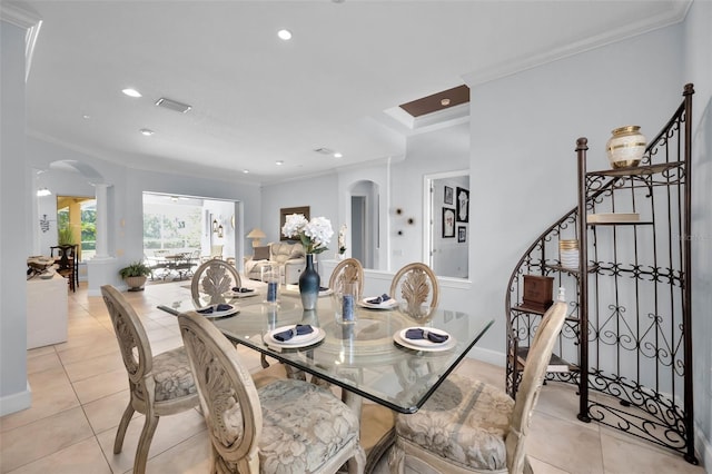 1033 Tuscany Dr, Trinity, FL 34655 - dining area with arched walkways, ornamental molding, and ornate columns