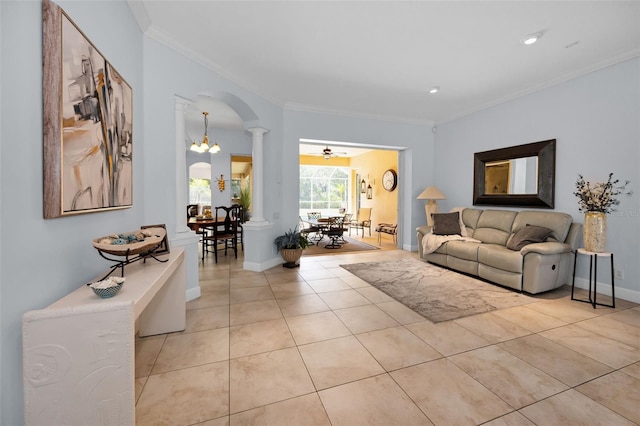 1033 Tuscany Dr, Trinity, FL 34655 - living area with crown molding, arched walkways, light tile patterned floors, and ornate columns