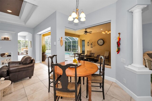 1033 Tuscany Dr, Trinity, FL 34655 - dining space with a healthy amount of sunlight, ornate columns, and light tile patterned flooring