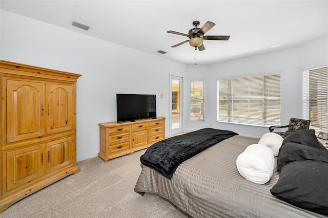 1033 Tuscany Dr, Trinity, FL 34655 - bedroom featuring ceiling fan, visible vents, light carpet, and baseboards