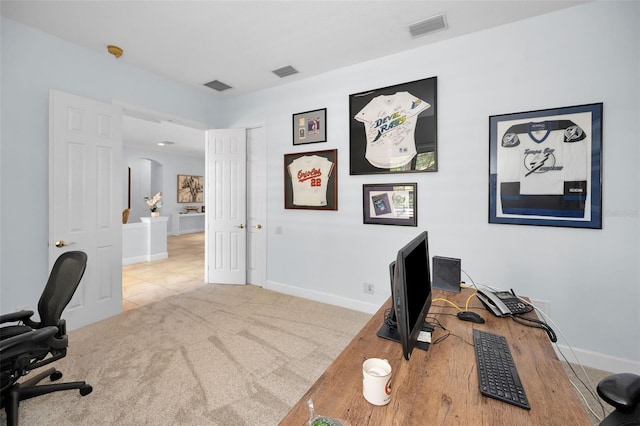1033 Tuscany Dr, Trinity, FL 34655 - office with visible vents, arched walkways, and baseboards