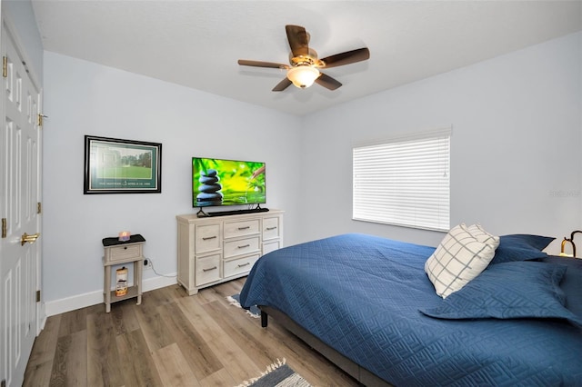 1033 Tuscany Dr, Trinity, FL 34655 - bedroom featuring a ceiling fan, baseboards, and wood finished floors