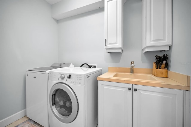 1033 Tuscany Dr, Trinity, FL 34655 - clothes washing area with a sink, separate washer and dryer, and cabinet space