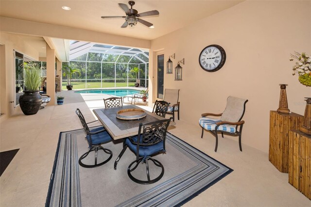 1033 Tuscany Dr, Trinity, FL 34655 - view of patio / terrace with outdoor dining area, ceiling fan, an outdoor pool, and a lanai