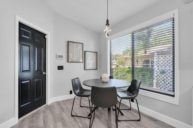 3047 Bolt Dr, Palm Harbor, FL 34685 - dining space with baseboards and wood finished floors