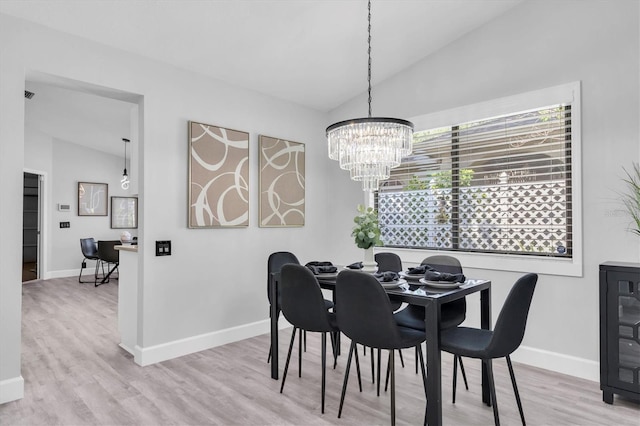 3047 Bolt Dr, Palm Harbor, FL 34685 - dining area with vaulted ceiling, a wealth of natural light, and a notable chandelier