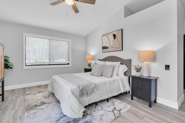 3047 Bolt Dr, Palm Harbor, FL 34685 - bedroom with vaulted ceiling, wood finished floors, a ceiling fan, and baseboards