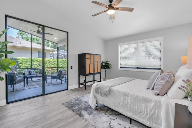3047 Bolt Dr, Palm Harbor, FL 34685 - bedroom with vaulted ceiling, access to outside, and multiple windows