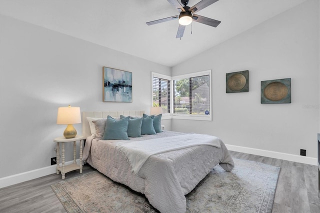 3047 Bolt Dr, Palm Harbor, FL 34685 - bedroom featuring baseboards, a ceiling fan, wood finished floors, and vaulted ceiling
