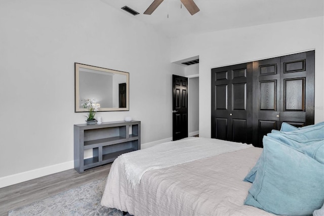 3047 Bolt Dr, Palm Harbor, FL 34685 - bedroom featuring visible vents, wood finished floors, baseboards, and a ceiling fan