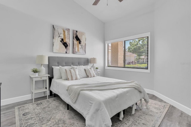 3047 Bolt Dr, Palm Harbor, FL 34685 - bedroom featuring lofted ceiling, baseboards, wood finished floors, and ceiling fan