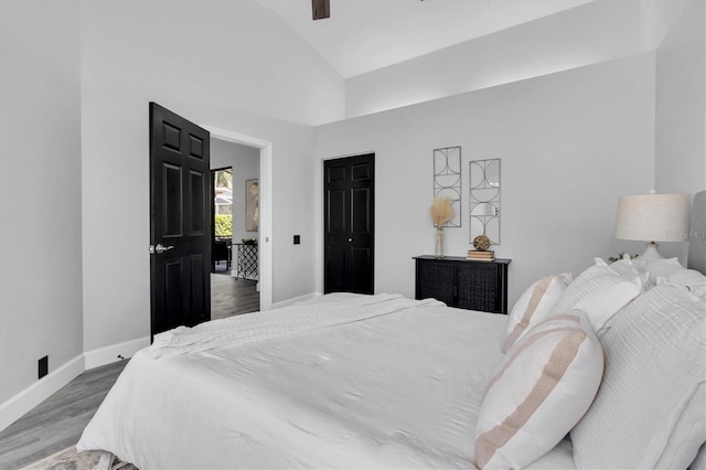 3047 Bolt Dr, Palm Harbor, FL 34685 - bedroom with ceiling fan, vaulted ceiling, baseboards, and wood finished floors