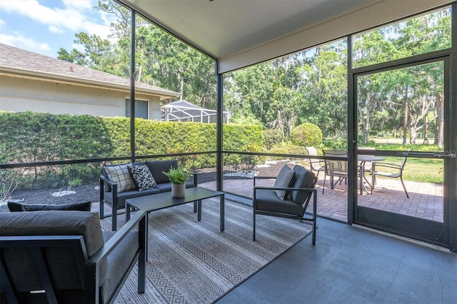 3047 Bolt Dr, Palm Harbor, FL 34685 - sunroom featuring an outdoor hangout area