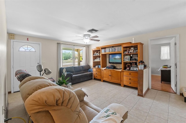 9640 Northcliffe Blvd, Spring Hill, FL 34608 - living area featuring baseboards, visible vents, light tile patterned floors, and a ceiling fan
