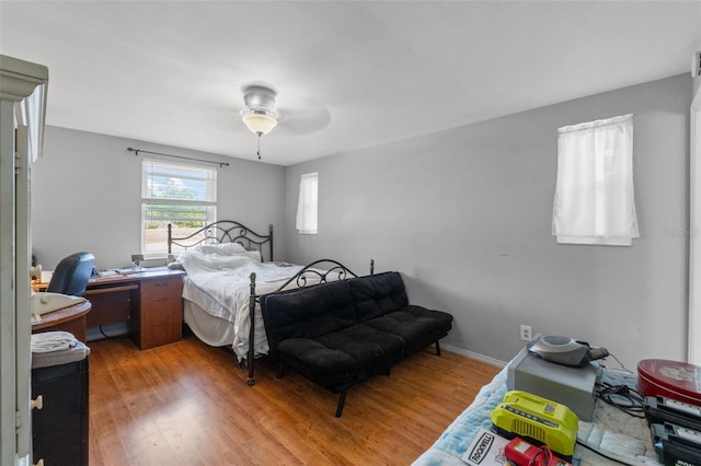 9640 Northcliffe Blvd, Spring Hill, FL 34608 - bedroom with baseboards, wood finished floors, and a ceiling fan