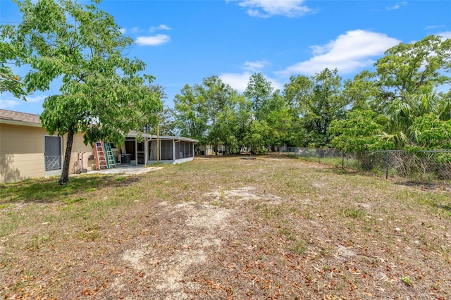 9640 Northcliffe Blvd, Spring Hill, FL 34608 - view of yard featuring a sunroom and fence