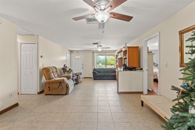 9640 Northcliffe Blvd, Spring Hill, FL 34608 - living room featuring baseboards, visible vents, light tile patterned floors, and a ceiling fan