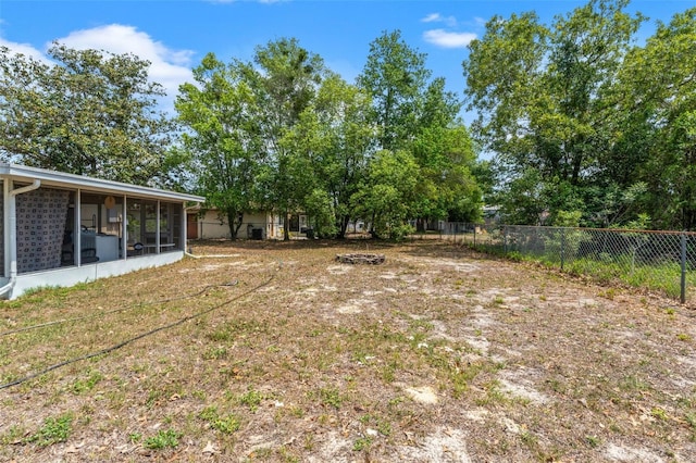 9640 Northcliffe Blvd, Spring Hill, FL 34608 - view of yard with fence and a sunroom