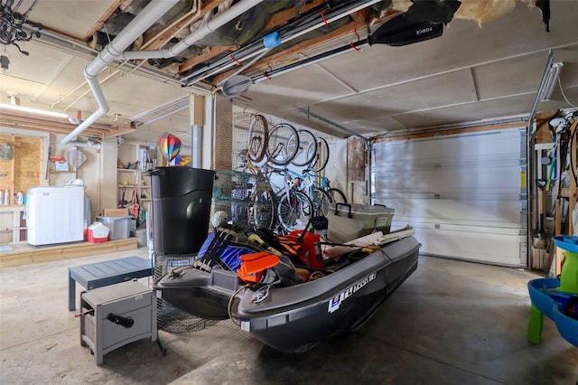 6622 Seaview Blvd, Hudson, FL 34667 - garage featuring washer / clothes dryer and a garage door opener