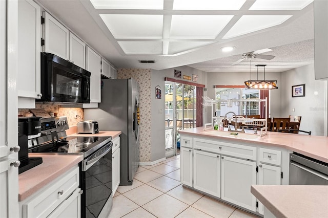 13469 Pia Ct, Spring Hill, FL 34609 - kitchen featuring a ceiling fan, a sink, appliances with stainless steel finishes, and light countertops