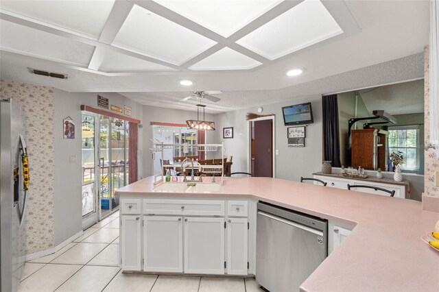 13469 Pia Ct, Spring Hill, FL 34609 - kitchen featuring white cabinets, a sink, light countertops, stainless steel appliances, and visible vents