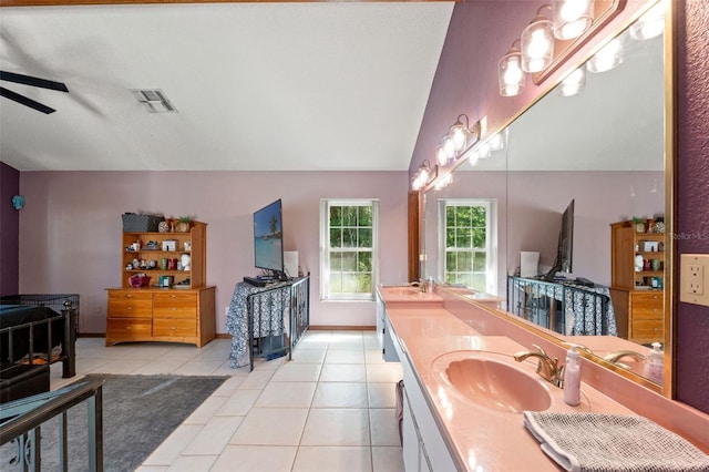13469 Pia Ct, Spring Hill, FL 34609 - bathroom with double vanity, a ceiling fan, visible vents, tile patterned flooring, and a sink
