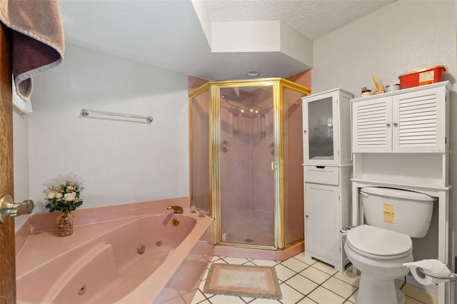 13469 Pia Ct, Spring Hill, FL 34609 - full bath featuring a textured ceiling, tile patterned flooring, a stall shower, a whirlpool tub, and toilet