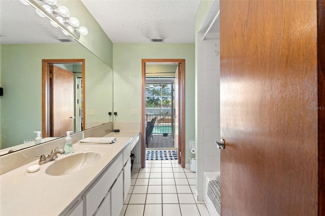 13469 Pia Ct, Spring Hill, FL 34609 - full bathroom featuring a bath, a textured ceiling, tile patterned flooring, and vanity