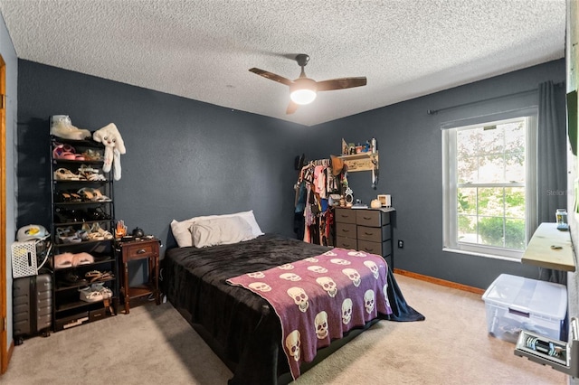 13469 Pia Ct, Spring Hill, FL 34609 - carpeted bedroom featuring baseboards, a textured ceiling, and ceiling fan
