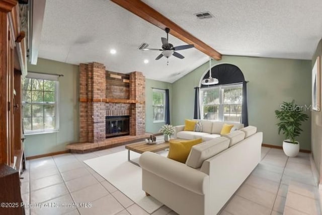 13469 Pia Ct, Spring Hill, FL 34609 - living area featuring a textured ceiling, a ceiling fan, light tile patterned flooring, a brick fireplace, and recessed lighting