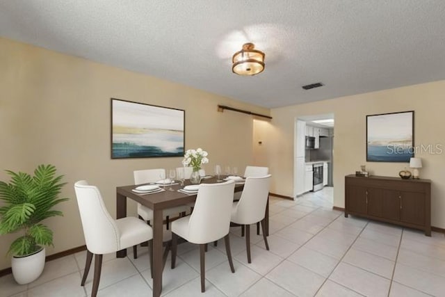 13469 Pia Ct, Spring Hill, FL 34609 - dining room with a textured ceiling and light tile patterned floors