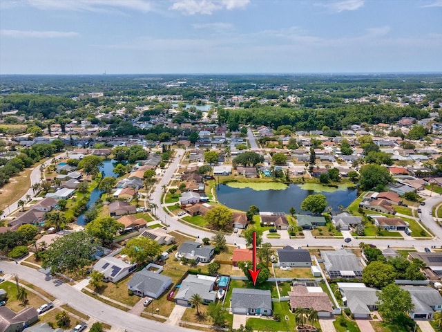birds eye view of property featuring a residential view and a water view