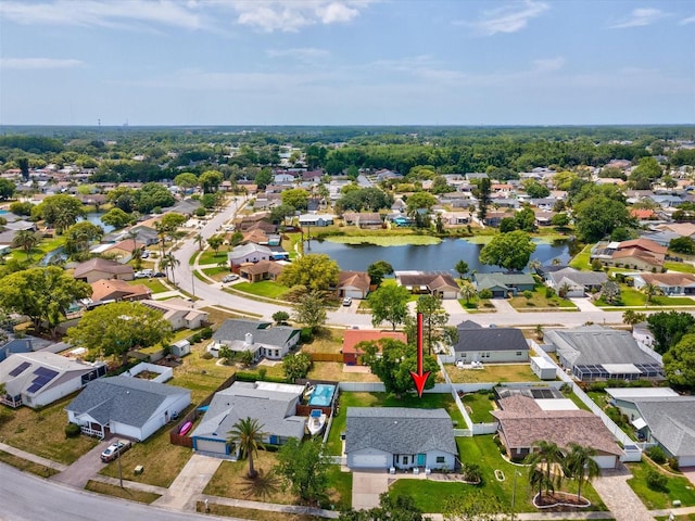 birds eye view of property featuring a residential view and a water view