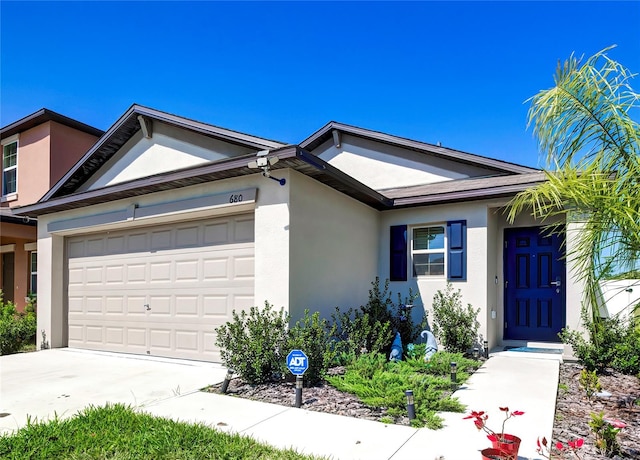 680 Argyll Dr, Spring Hill, FL 34609 - ranch-style home with stucco siding, driveway, and a garage
