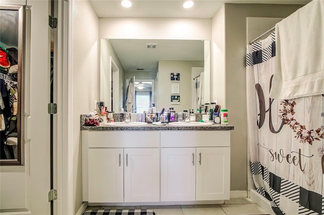 680 Argyll Dr, Spring Hill, FL 34609 - bathroom with tile patterned floors, a sink, recessed lighting, and double vanity