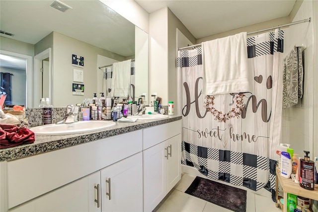 680 Argyll Dr, Spring Hill, FL 34609 - bathroom featuring a sink, a shower with curtain, double vanity, tile patterned flooring, and visible vents
