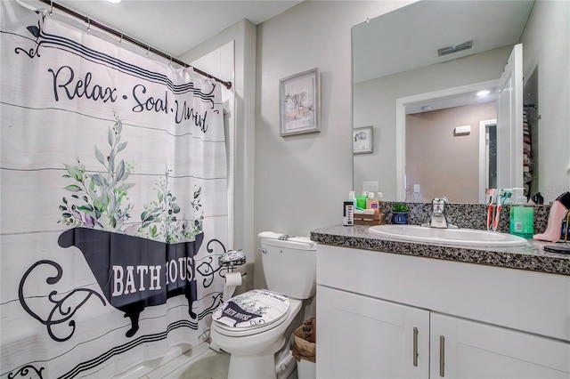 680 Argyll Dr, Spring Hill, FL 34609 - full bathroom with a shower with shower curtain, visible vents, toilet, and vanity