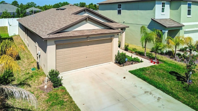 680 Argyll Dr, Spring Hill, FL 34609 - view of front of home with stucco siding, roof with shingles, and concrete driveway