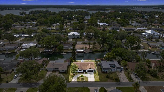 bird's eye view featuring a water view and a residential view