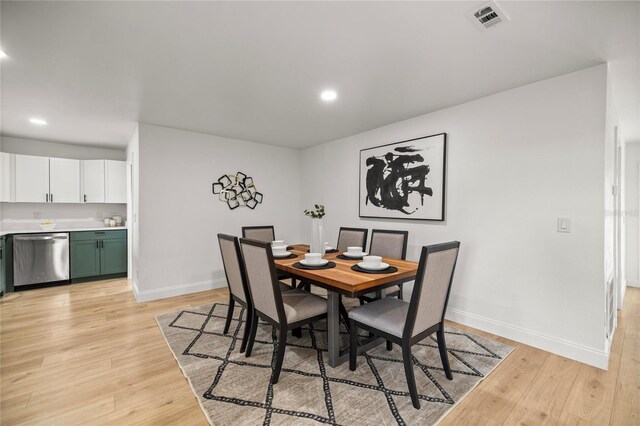 dining room with visible vents, light wood-style flooring, baseboards, and recessed lighting